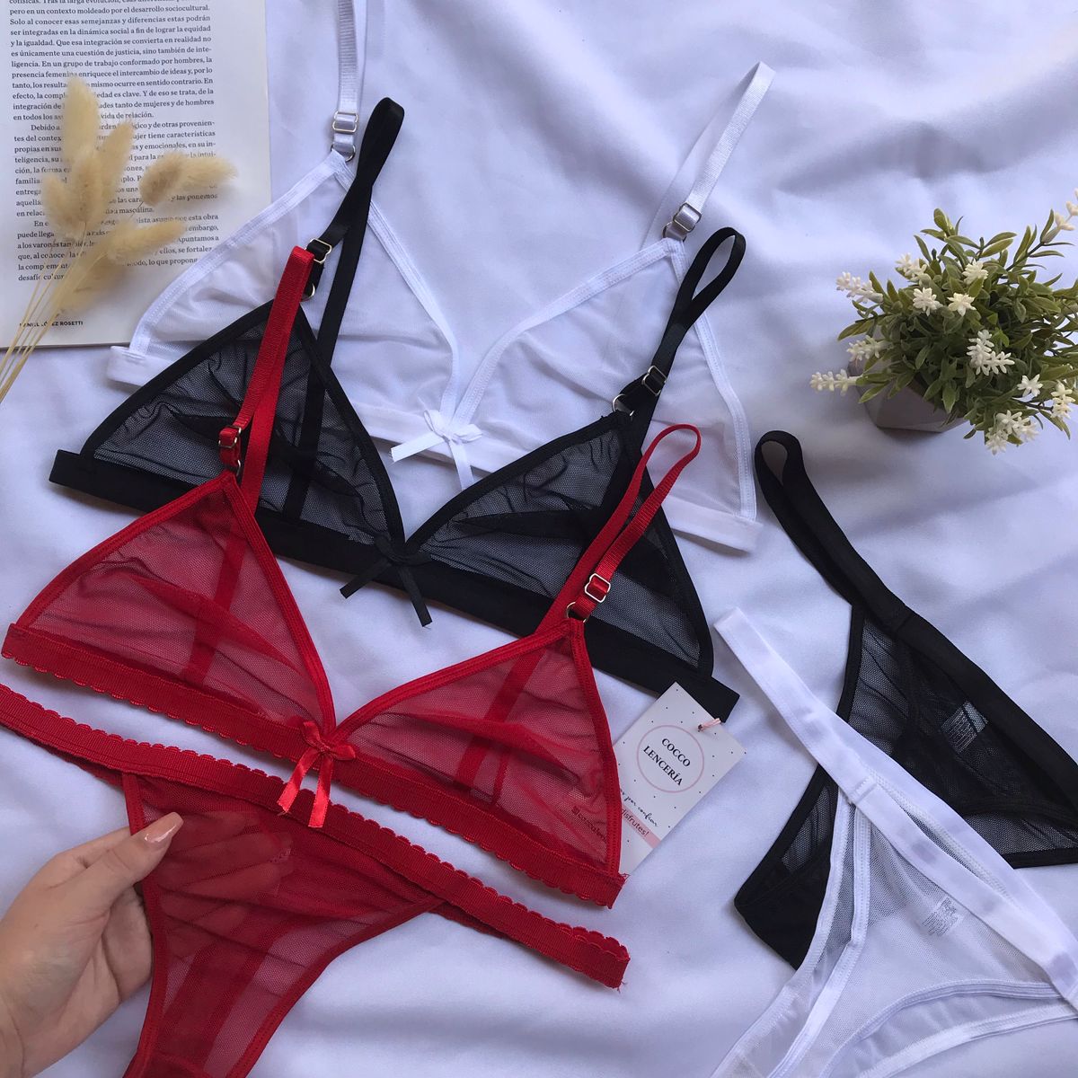 Bikini and lingerie product flat lay on white surface