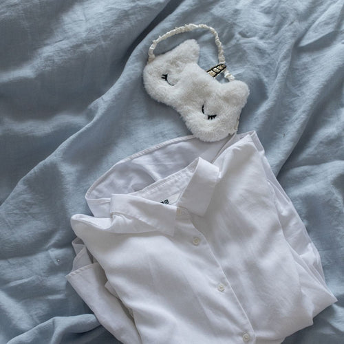 White sleepwear product flat lay